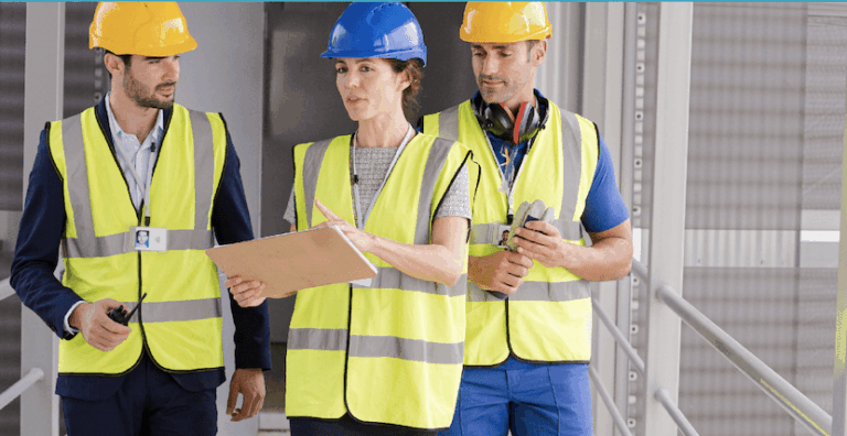 Construction team discussing project on site