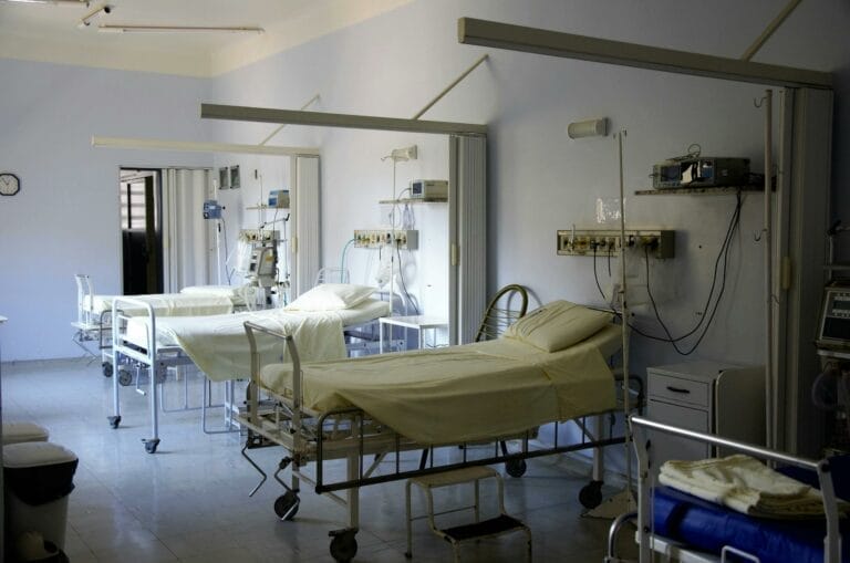 Empty hospital beds in a medical ward