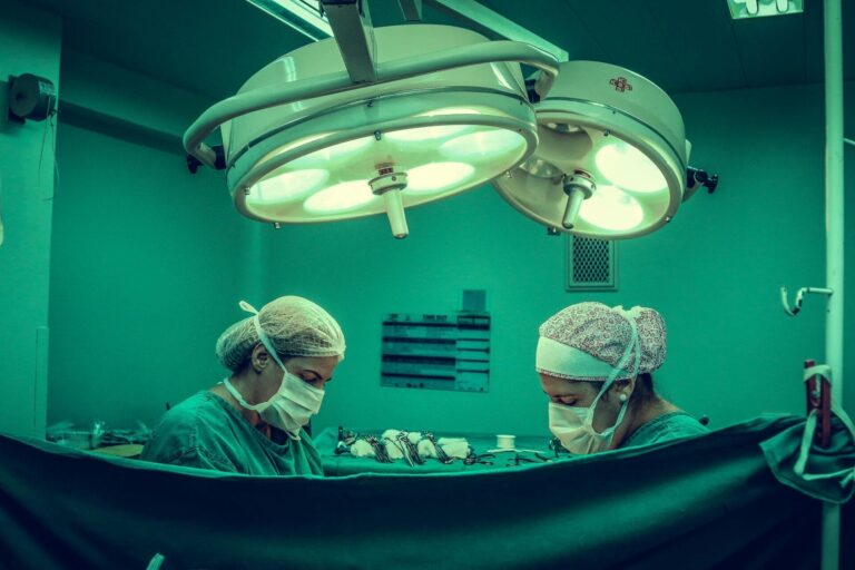 Surgeons performing operation in operating room
