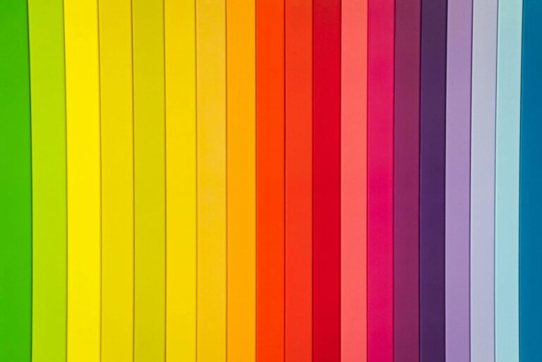 Vertical rainbow stripes on colorful paper