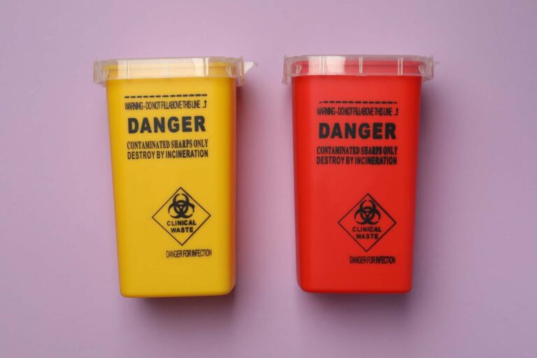Yellow and red clinical waste disposal bins.