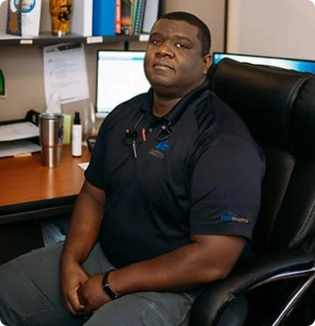 Employee working at the desk. Medsharps Leadership Team. Walter Nolden
